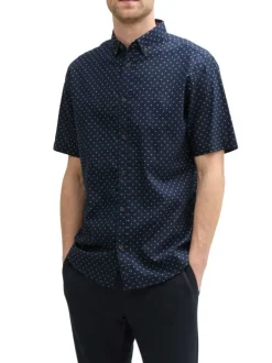 Chemise marine à pois blancs avec coupe regular fit et col boutonné