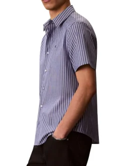 Chemise à rayures verticales en coton bleue pourvue d'un col à revers