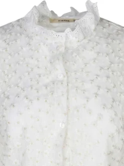 Chemisier beige avec des motifs fleuris à coupe droite et un col montant