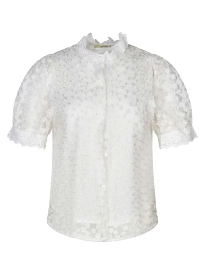 Chemisier beige avec des motifs fleuris à coupe droite et un col montant