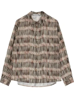Chemisier beige à motifs imprimés avec une coupe droite et un col à revers