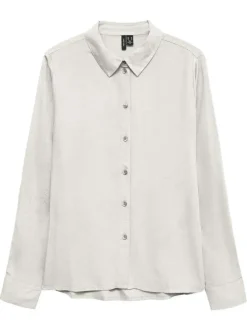 Chemisier blanc uni avec un col chemise et des manches longues