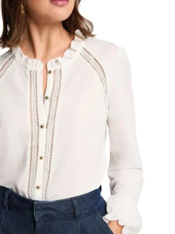 Chemisier blanc uni avec une coupe droite et des manches longues