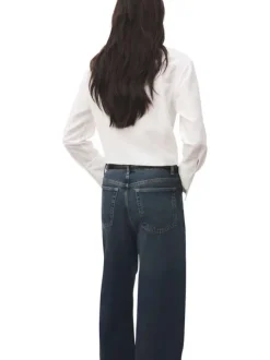 Chemisier blanc uni avec une coupe droite et un motif floral ajouré