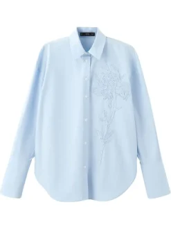 Chemisier bleu ciel uni avec une coupe ample et des manches longues