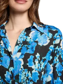 Chemisier bleu fleuri à coupe droite avec col à revers et manches longues