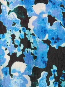 Chemisier bleu fleuri à coupe droite avec col à revers et manches longues