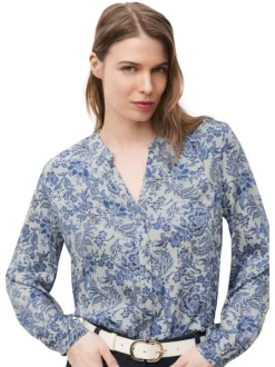 Chemisier bleu floral avec une coupe droite et un col tunisien