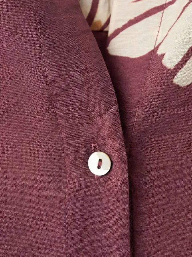 Chemisier bordeaux à motifs pourvu de manches longues et d'une coupe large