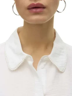 Chemisier écru uni avec un col chemise perlé et des manches longues
