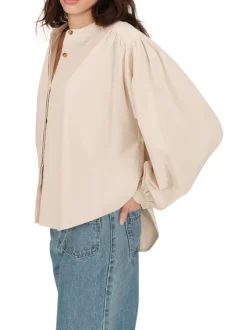 Chemisier en coton beige uni en velours avec une coupe ample et un col rond