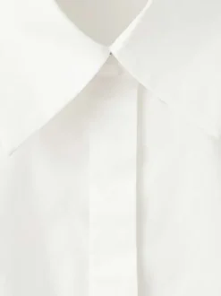 Chemisier en coton blanc uni avec une coupe droite et un col à revers