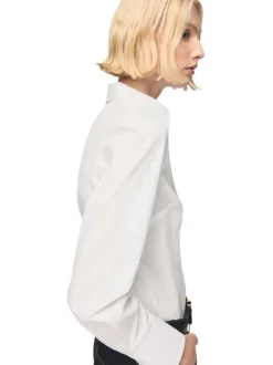 Chemisier en coton blanc uni avec une coupe droite et un col à revers