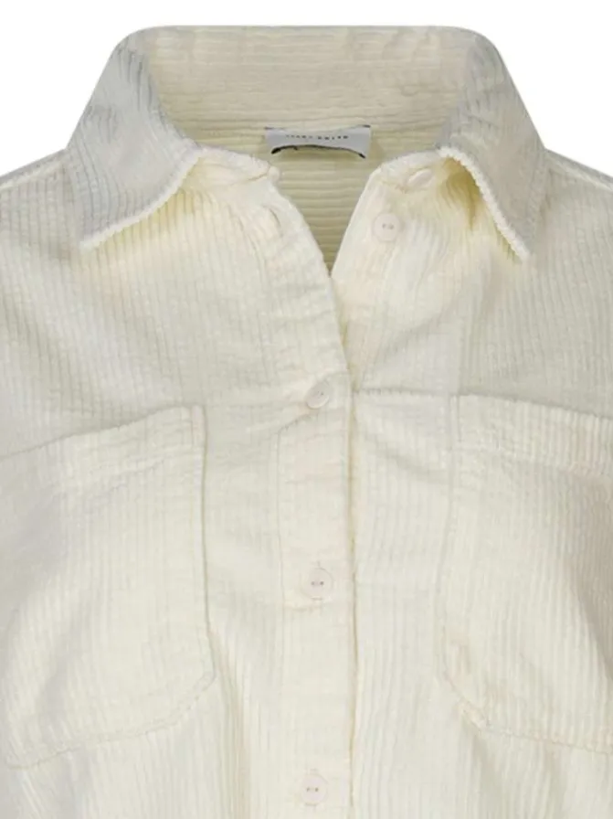 Chemisier en coton écru uni coupe ajustée avec un col chemise