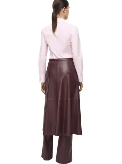 Chemisier en coton rose uni avec une coupe droite et un col à revers
