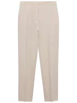 Chino beige uni avec pli marqué et des poches à l'italienne à l'avant