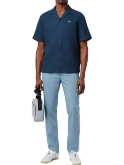 Chino 5 poches en coton bleu uni avec une coupe slim fit et une taille mi-haute