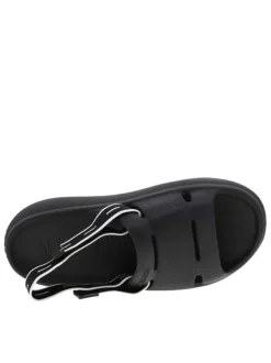 Claquettes noires moulées à semelle plateforme basse et bande élastiquée