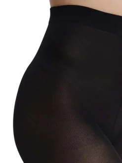 Collants moulants noirs unis opaques et avec une taille haute