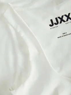 Débardeur blanc uni avec une coupe près du corps et un col rond réversible