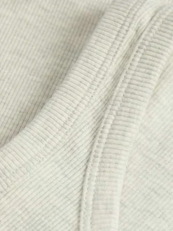 Débardeur en coton beige chiné et côtelé avec une coupe crop top près du corps