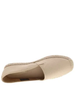 Espadrilles beiges avec un talon plat et un petit soufflet élastiqué