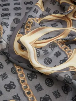 Foulard noir imprimé de motifs dorés représentant des chaînes