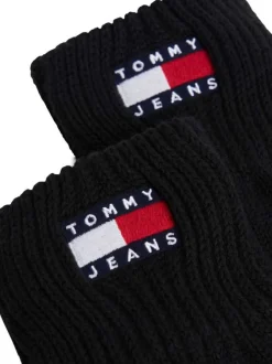 Gants en coton biologique noirs unis avec le logo de la marque cousu au poignet