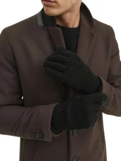 Gants noirs unis avec le logo iconique au poignet et les bords côtelés