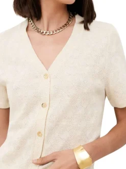 Gilet beige à coupe droite pourvu d'un col v et de manches courtes