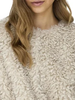 Gilet beige en maille sherpa pourvu d'un col rond et de manches longues