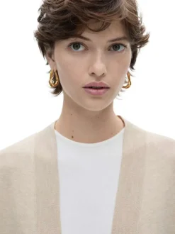Gilet beige uni avec une coupe droite et des manches longues