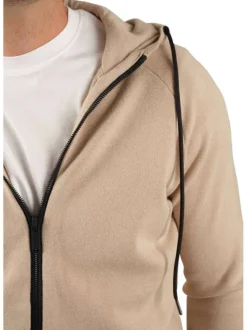 Gilet beige uni à capuche avec une double fermeture zippée et des cordons