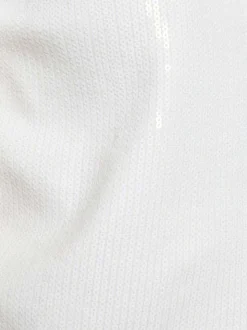 Gilet blanc uni pourvu d’une coupe droite et de manches courtes