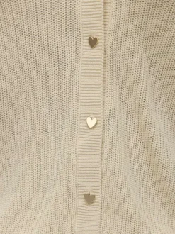 Gilet écru uni avec un col v profond et boutonnière dorée