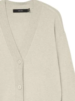 Gilet écru uni avec un col v profond et boutonnière mate à l'avant