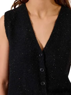 Gilet noir moucheté avec une coupe ajustée et un col v profond