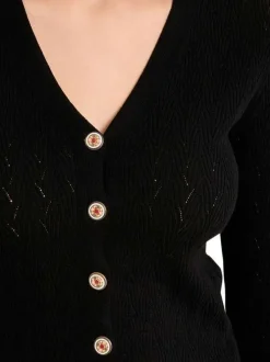 Gilet noir uni pourvu de manches longues et d'une coupe droite