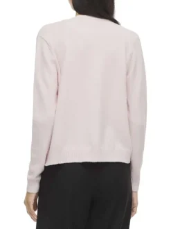 Gilet rose uni court avec une coupe droite et des manches longues