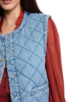 Gilet sans manche en coton bleu à coupe droite pourvu d'une fermeture boutonnée