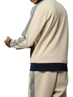 Gilet zippé écru à imprimé monogrammes sur les manches et à col montant