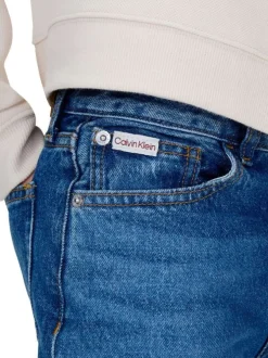 Jean en coton bleu uni coupe regular intermédiaire avec des surpiqûres camel
