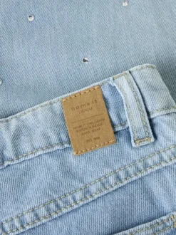 Jean en coton bleu uni pourvu de multiples poches et d'une coupe droite