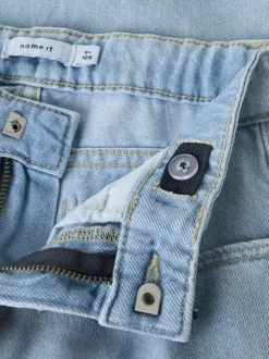 Jean en coton bleu uni pourvu de multiples poches et d'une coupe droite