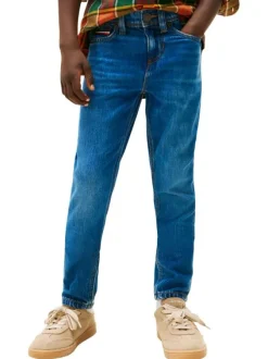 Jean en coton indigo coupe slim avec le patch de la marque à l'arrière