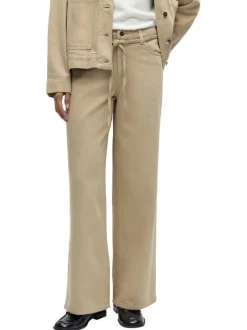 Jean beige uni pourvu d'une coupe bootcut et d'un lien à nouer à la taille
