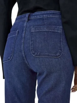 Jean bleu brut uni en coton avec une coupe bootcut et ourlet large