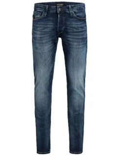 Jean bleu délavé avec une coupe ajustée et une fermeture zippée boutonnée