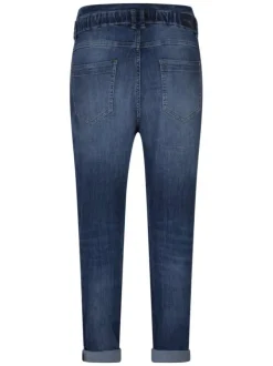 Jean bleu effet délavé avec une coupe carotte et fermeture à zip et bouton