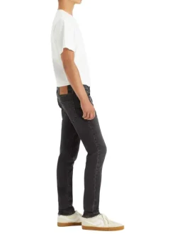 Jean 512 brut uni avec une coupe slim et un patch d'authentification